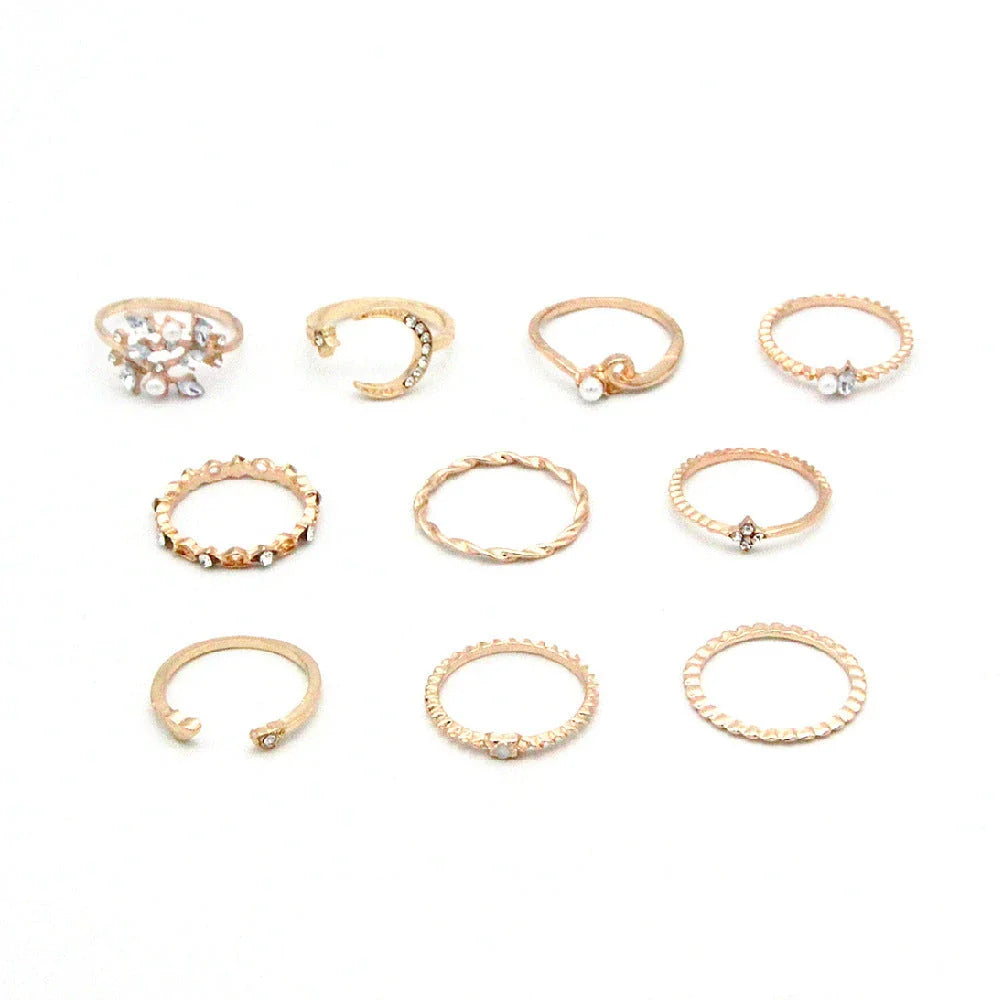 Gold-plated adjustable ring set with moon, star, and leaf charms in a bohemian style