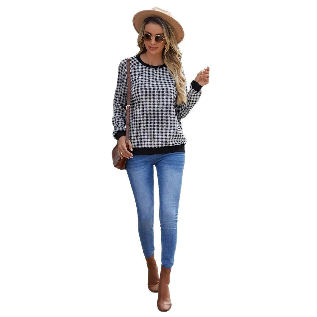 Black plaid pullover sweater with striped pattern and long sleeves, showing printing detail on polyester fabric