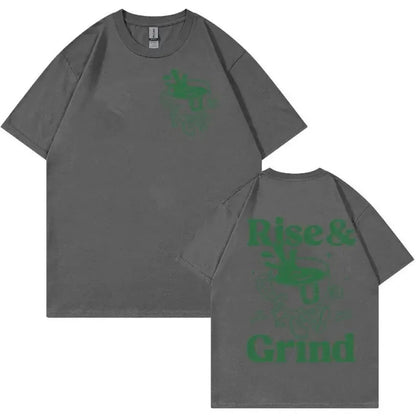 Men's loose grey linen t-shirt with a printed green coffee cartoon and 'Rise and Grind' text.