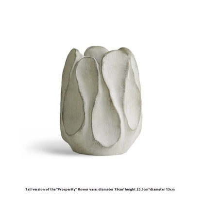 Hand-formed irregular ceramic vase measuring 25cm tall with 15cm diameter opening, made from magnesium clay