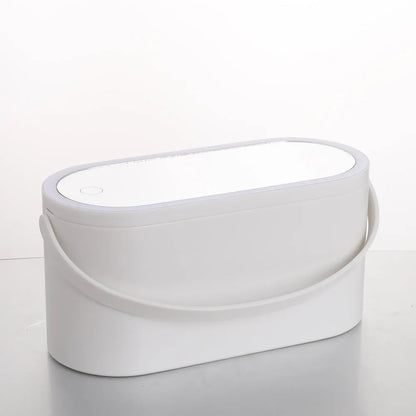 Pink gradient makeup storage box with LED mirror open, showing internal compartments and USB charging port.