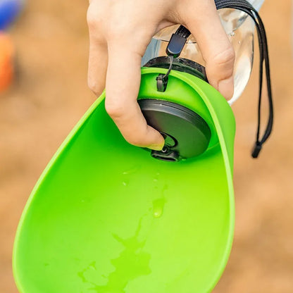 Blue portable pet water bottle with drinking bowl for dogs, showing 680ml capacity and hanging attachment