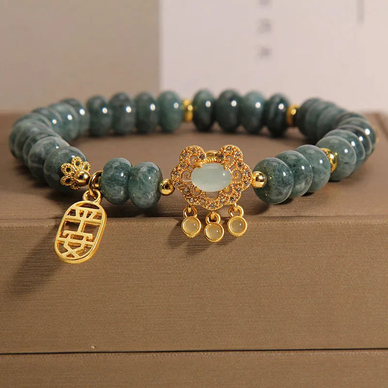 Women's natural emerald jade bracelet with abacus bead design and safety lock clasp