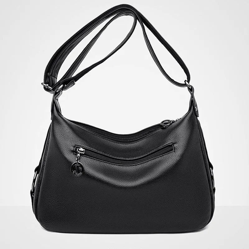 Large blue women's shoulder bag with crossbody strap and multiple internal compartments
