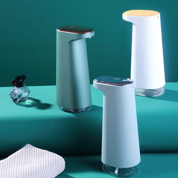 White automatic foam soap dispenser with infrared sensor for touch-free hand washing.