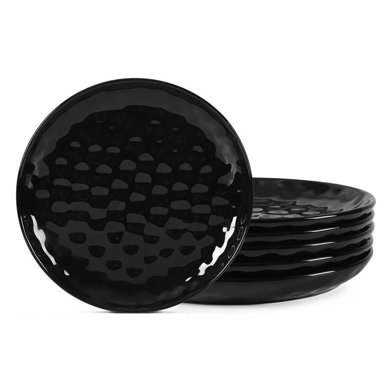 Elegant black ceramic dinner plate set with hammered design, perfect for parties and family dinners.