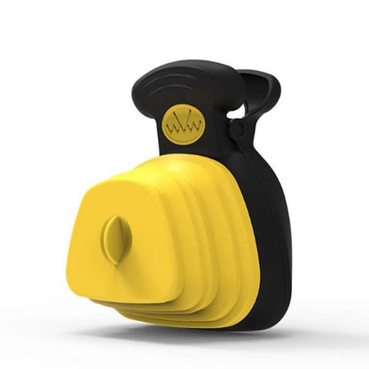 Blue portable dog pooper scooper with carabiner clip and waste bag dispenser, shown next to a waste bag.