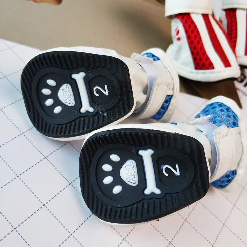 Blue dog shoes with front zipper closure and non-slip rubber soles for small pets.