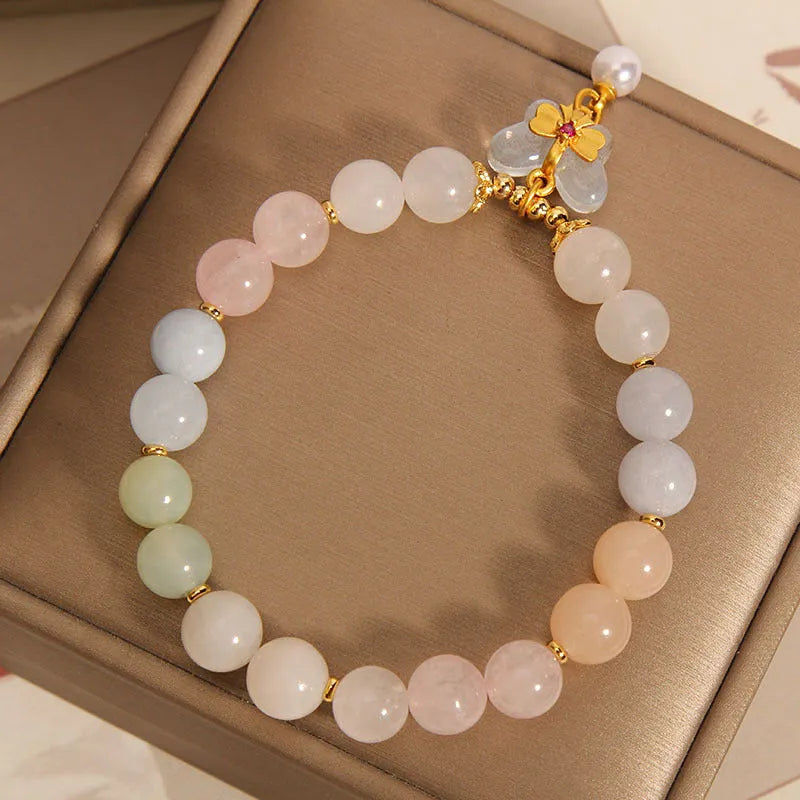 Original design women's bracelet with colourful morganite butterfly pendant made from crystal and jade.