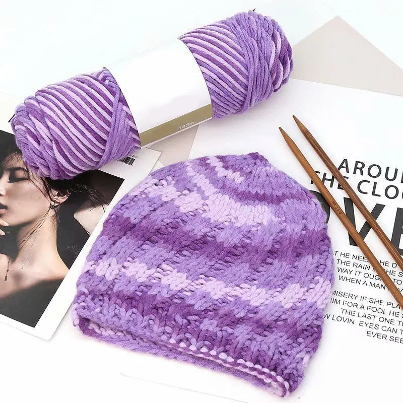 Eight strands of gradient milk cotton wool in a ball, showing multiple colour options for hand knitting.