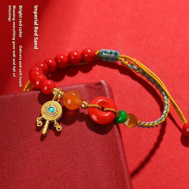 Hand-woven cinnabar peace blessing bracelet in emperor red sand colour with geometric design