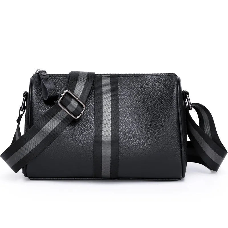 Black genuine leather one-shoulder crossbody bag with large main compartment and polyester lining.