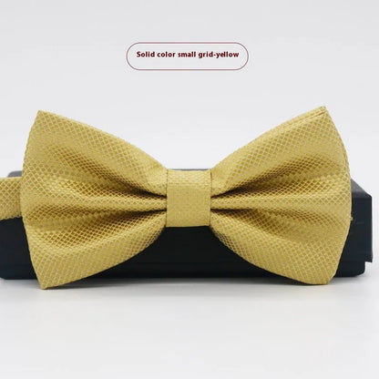A solid colour pre-tied bow tie with an adjustable neck strap, shown in a classic flat head shape.