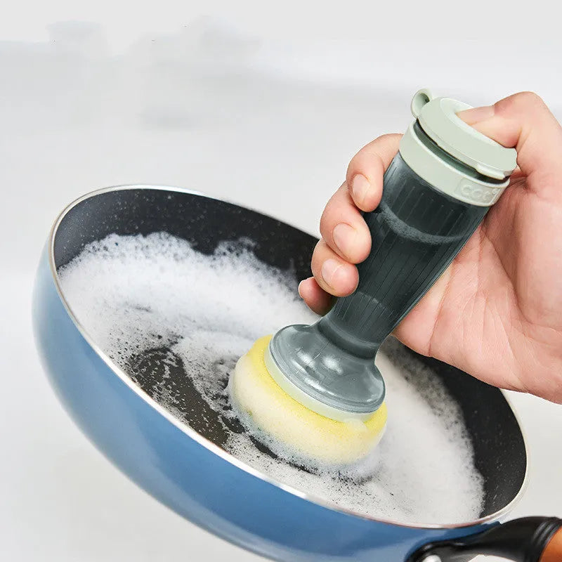 Milk white and mint green pot scrub brush with a soap dispenser handle and replaceable non-scratch bristles.