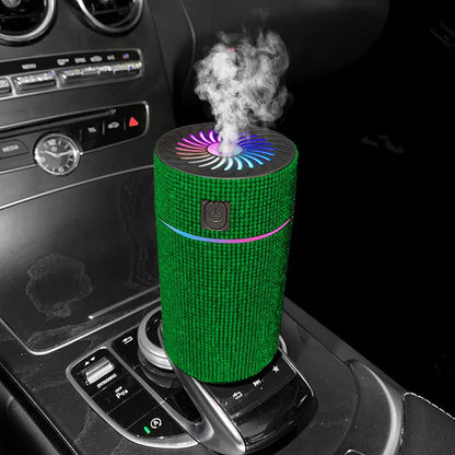 Compact white car air purifier and humidifier unit with USB cable on a car dashboard.