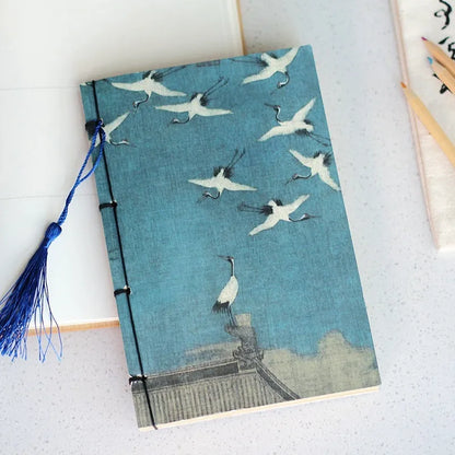 A5 antique wire-bound notebook with classical artwork cover, black oil wax rope binding, and decorative tassels