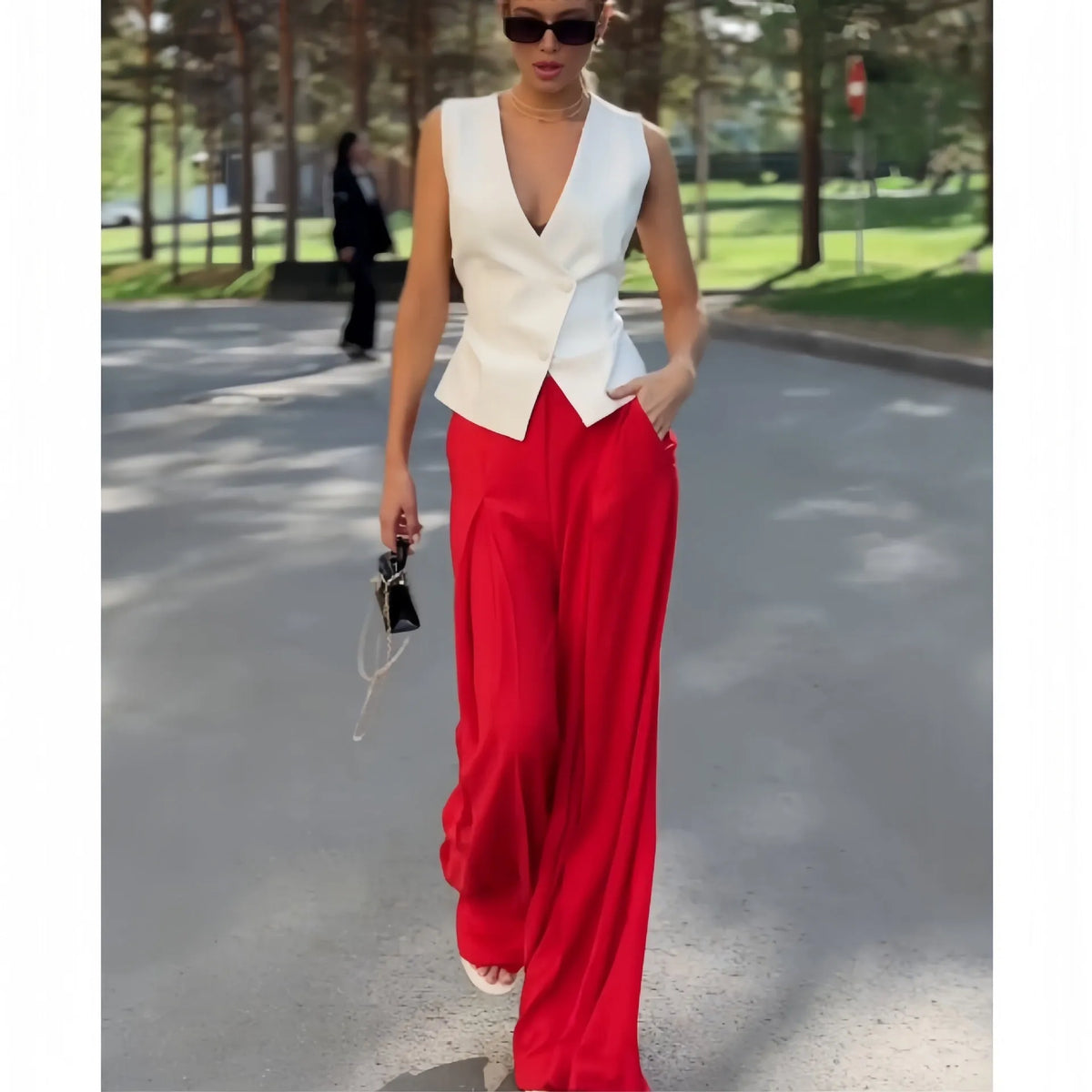 Women's beige polyester two-piece set with deep V-neck sleeveless top and wide-leg trousers