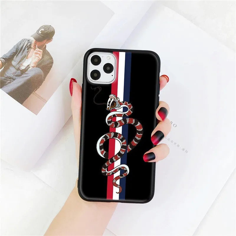 Black frosted silicone iPhone case with cartoon snake design shown on mobile phone