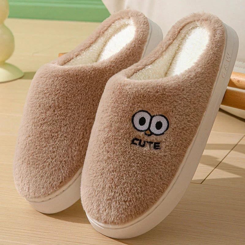 Stylish and cozy cartoon-inspired slippers with plush material and non-slip rubber soles, perfect for keeping feet warm and comfortable at home.