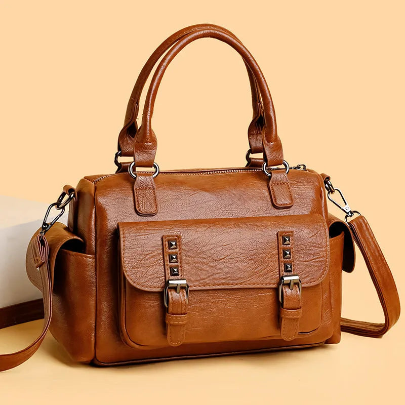 Vintage style messenger bag in PU leather with contrast stitching, horizontal square shape, shown in multiple colour options