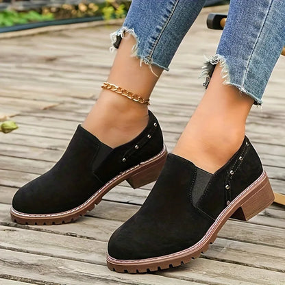 Light brown plus size women's suede ankle boot with low thick heel and elastic band detail.
