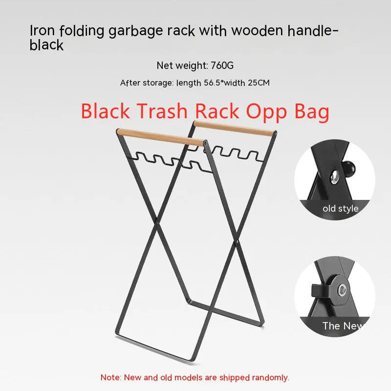 Black outdoor folding trash rack with wooden handle, holding a waste bag.