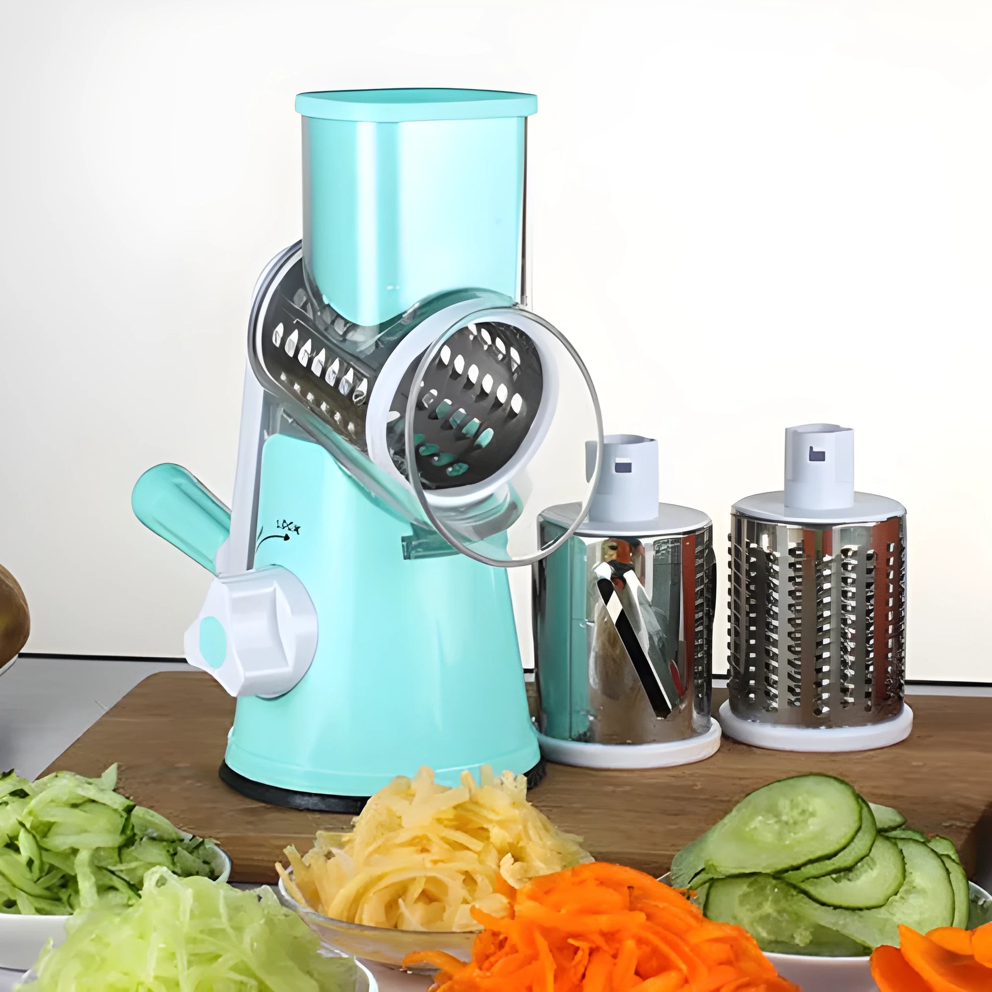 Blue multifunctional round mandoline vegetable slicer and cheese grater with stainless steel blades on a kitchen counter.