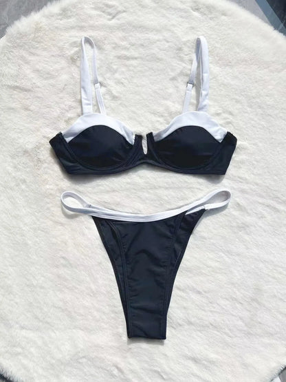 Women's black low waist bikini swimsuit with stitching detail and split brief design.