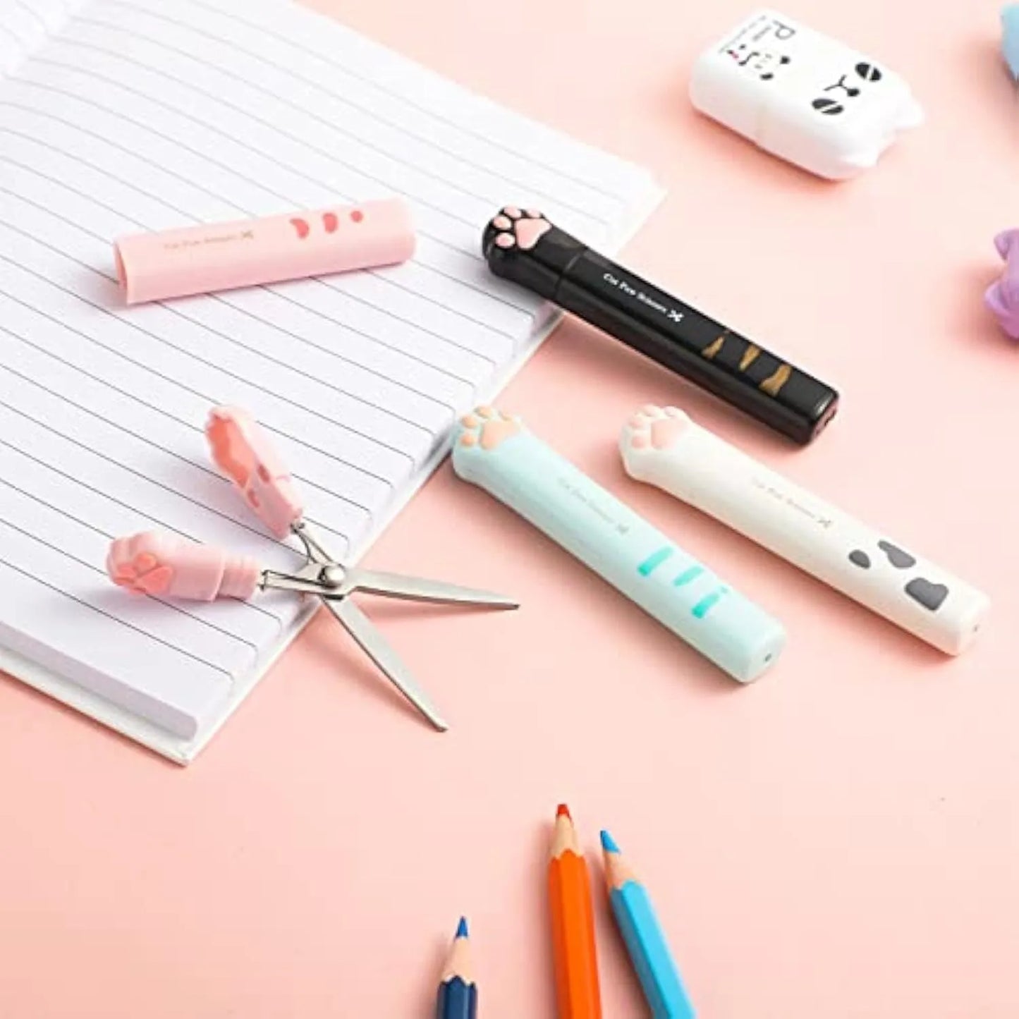 Closed cat paw design mini folding scissors showing safety lock, in choice of colours.