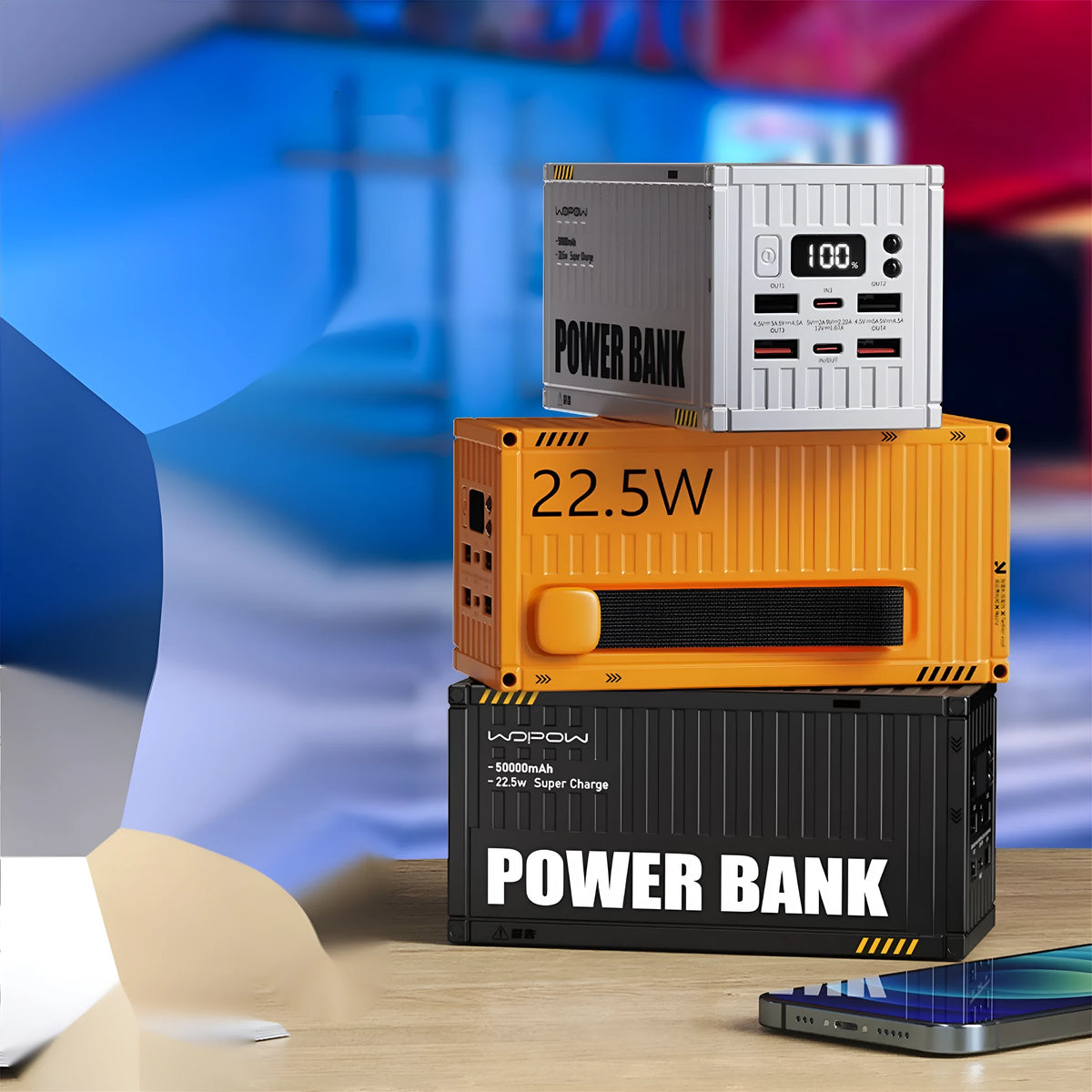 Yellow 50000mAh portable power bank with digital display showing battery percentage and five output ports.