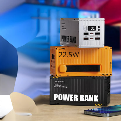 Yellow 50000mAh portable power bank with digital display showing battery percentage and five output ports.