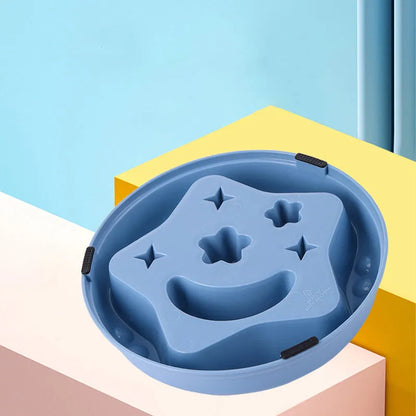 Blue slow feeder dog bowl with raised moon and star patterns inside, non-slip base