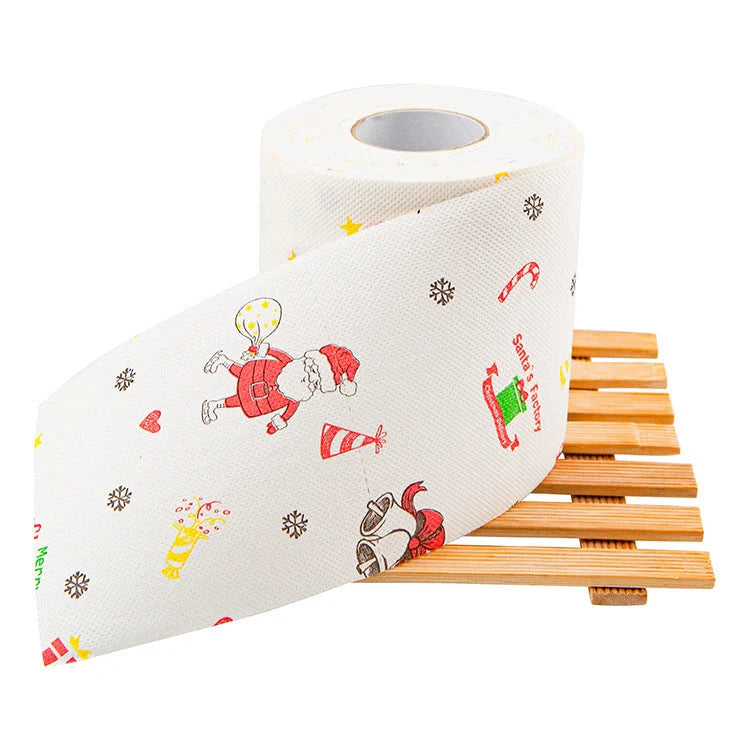 Christmas-themed toilet paper roll with Santa Claus and holiday designs