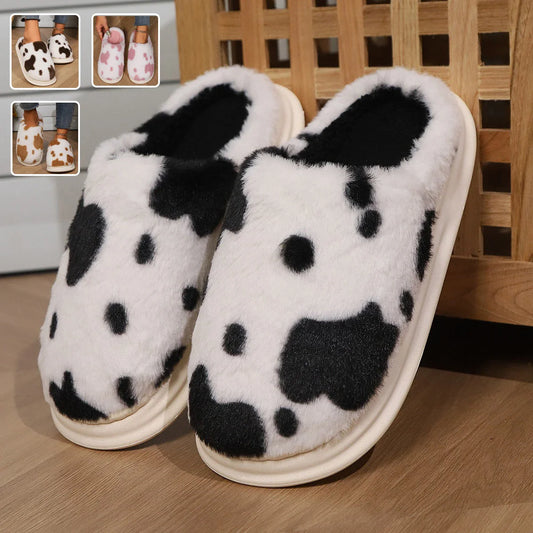 Cozy cow print plush slippers with soft, cushioned soles and non-slip outsoles for indoor comfort and warmth