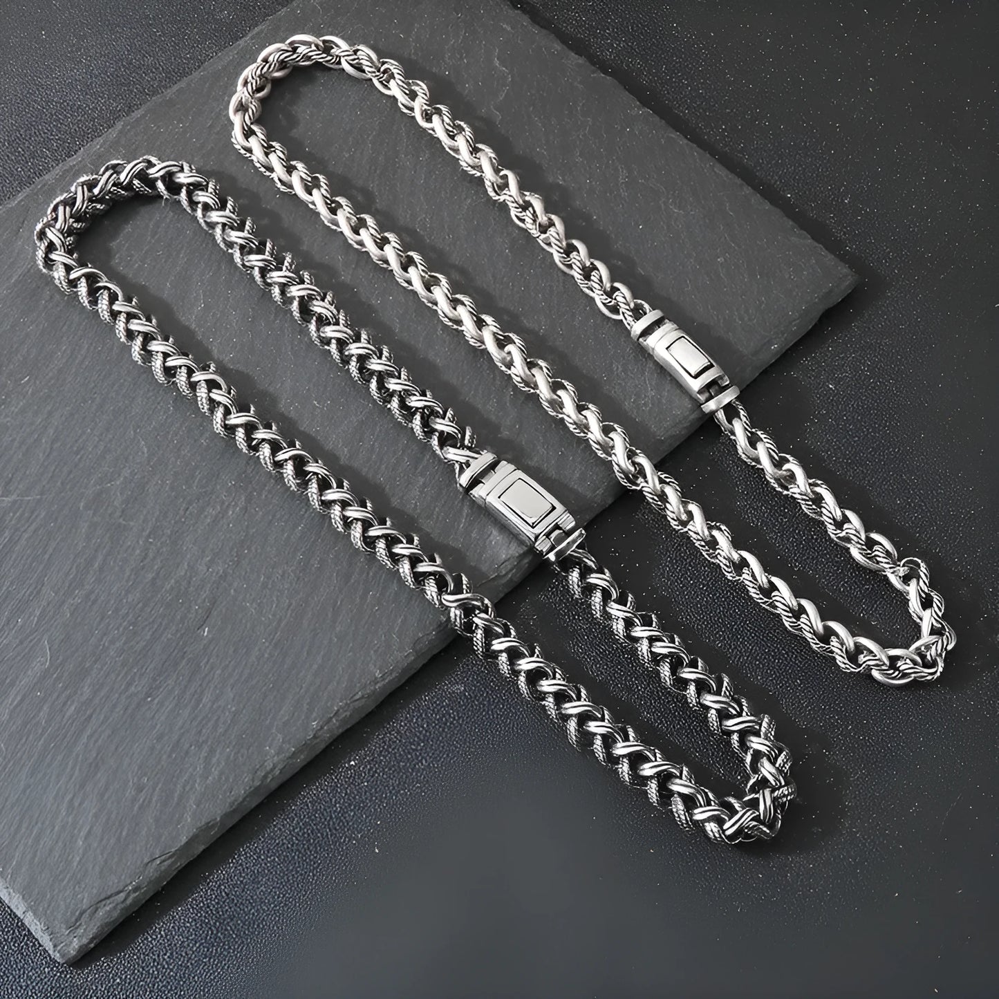 Men's antique silver titanium steel keel chain necklace with large geometric links on a black background.