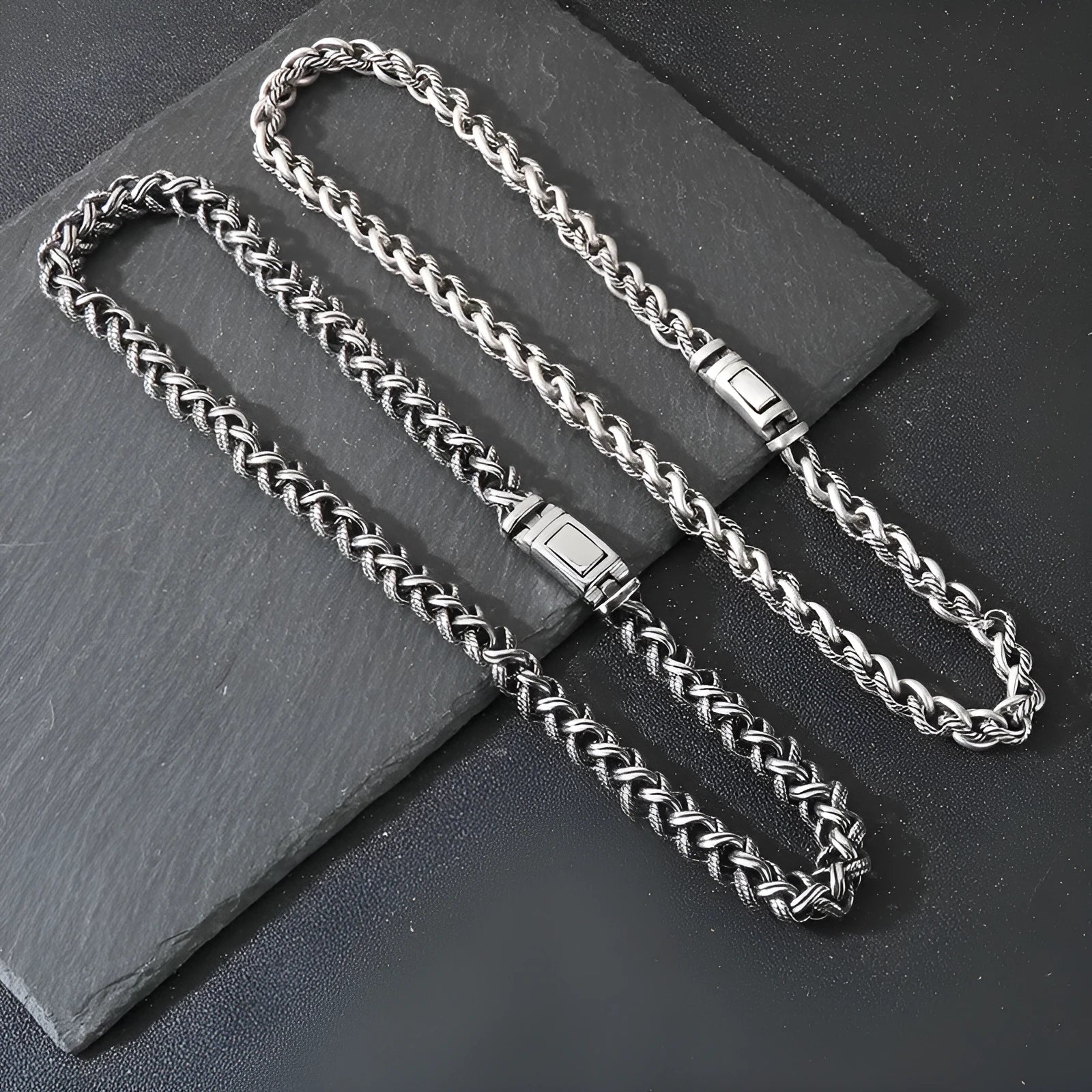 Men's antique silver titanium steel keel chain necklace with large geometric links on a black background.