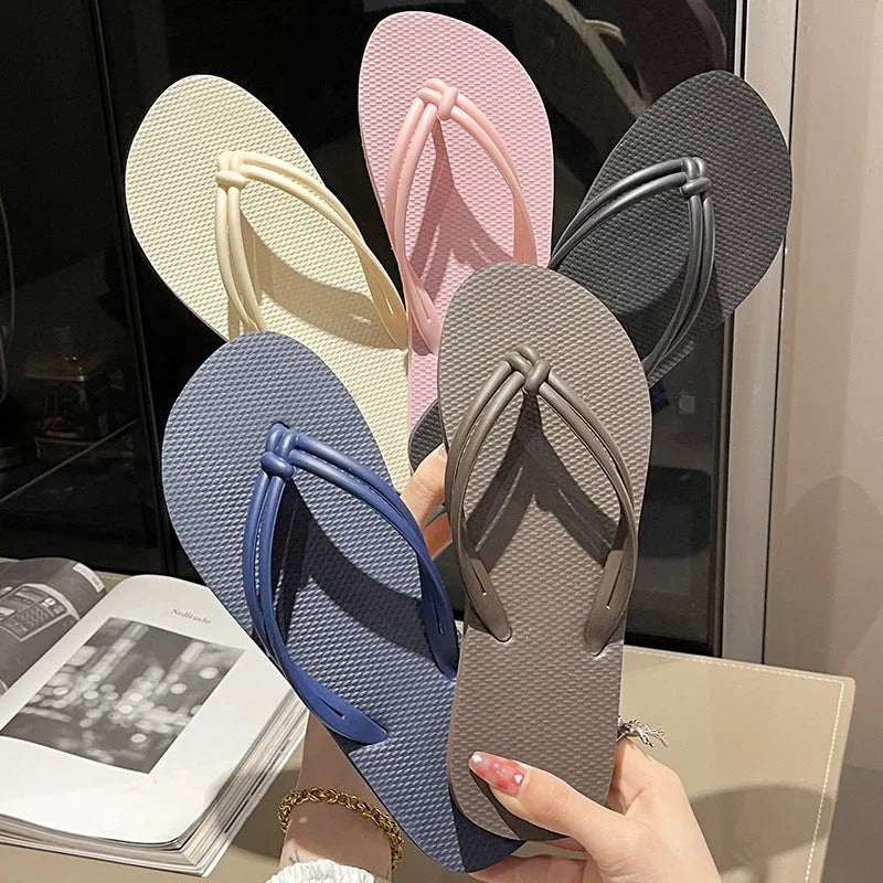 Men's PVC toe-covering flip-flop slippers on a white background, showing the injection moulded sole and available colour options.