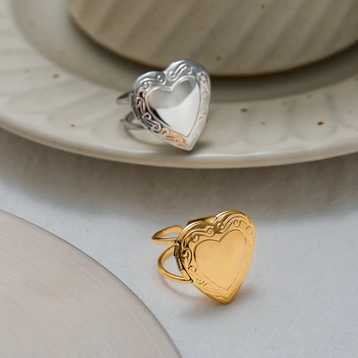 Stainless steel love heart-shaped ring for women with electroplated finish, shown as a single ring