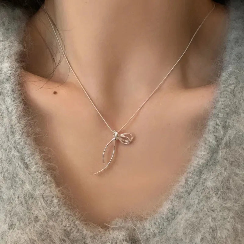 Women's minimalist bow necklace with copper pendant, cross chain, electroplated finish, 41-50cm circumference