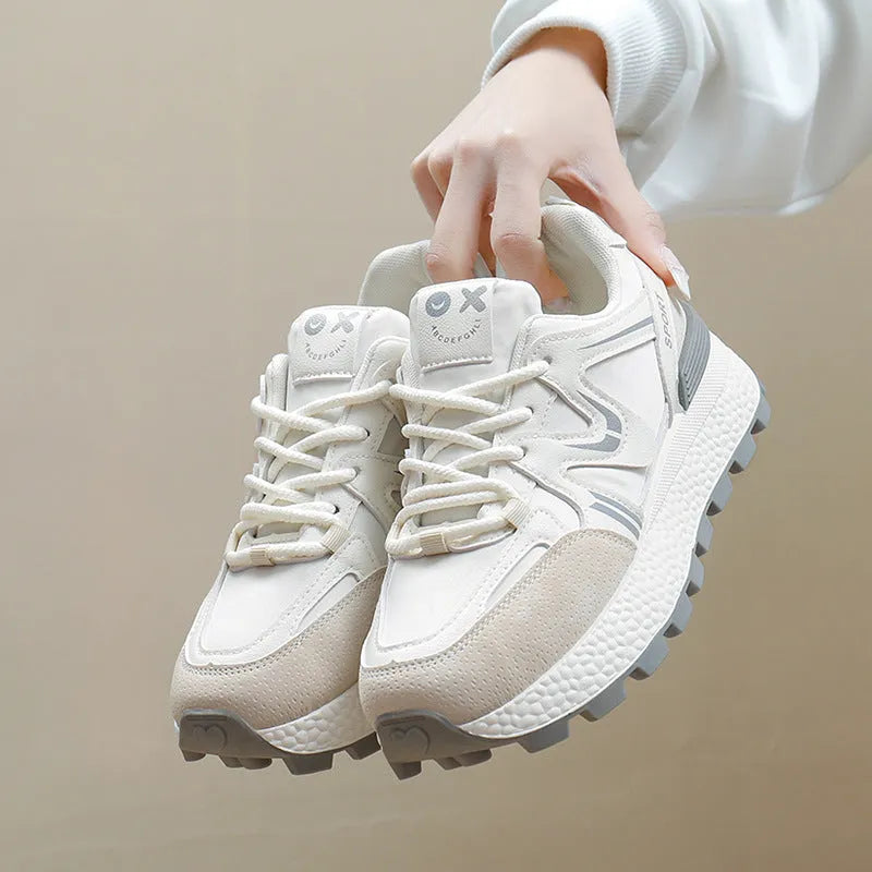 Women's black sports casual shoes with round toe and front lace-up design on a flat heel.