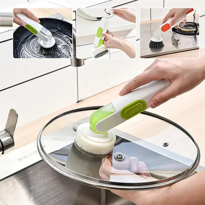 White and red long-handle kitchen brush with soap dispenser button and two interchangeable scrub heads on a hook.