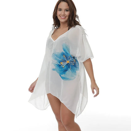 White plus size loose-fit beach blouse cover-up with long sleeves, shown on a hanger.