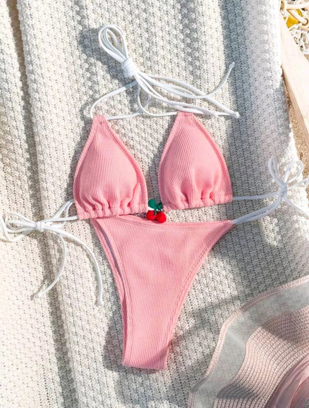 Women's sexy wind style bikini swimsuit in a solid colour, showing backless briefs design.