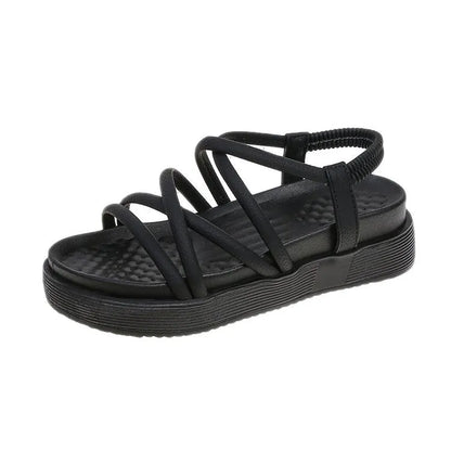Women's black Roman platform sandals with straps on a white background.
