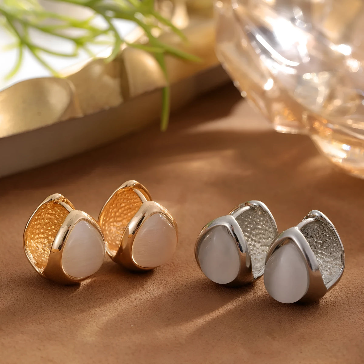 Cat's eye stone water drip ear buckle earrings in gold or silver colour, retro niche design for women.