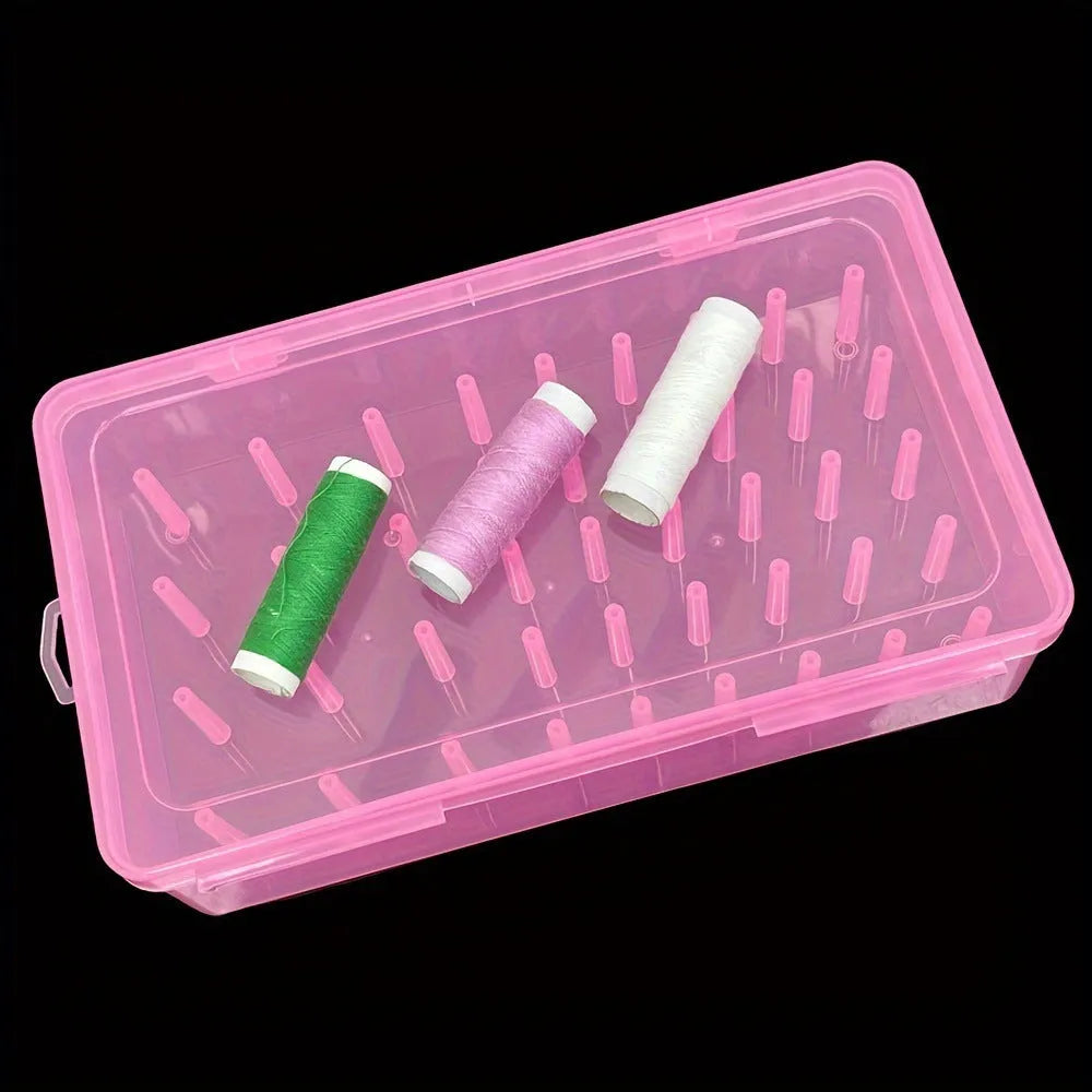 42-slot embroidery thread storage box in transparent plastic with visible spools inside