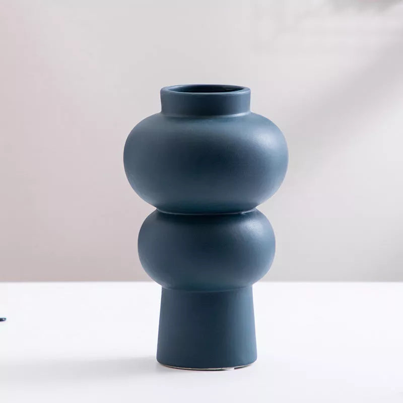 Nordic minimalist ceramic vase with glazed finish in blue, yellow, and orange options