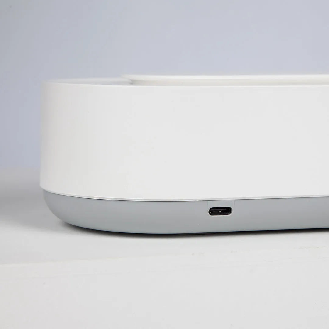 White portable ultrasonic cleaner with stainless steel tank for cleaning jewellery and glasses.
