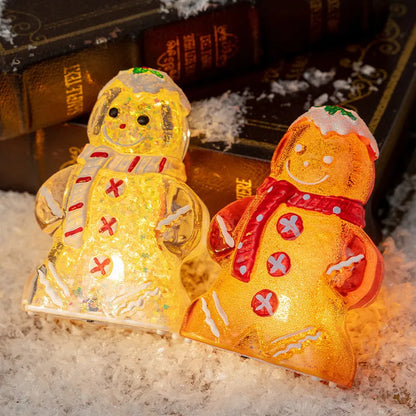 Glowing Christmas gingerbread man and snowman ornaments with LED lights in red, white, and transparent scarf variations