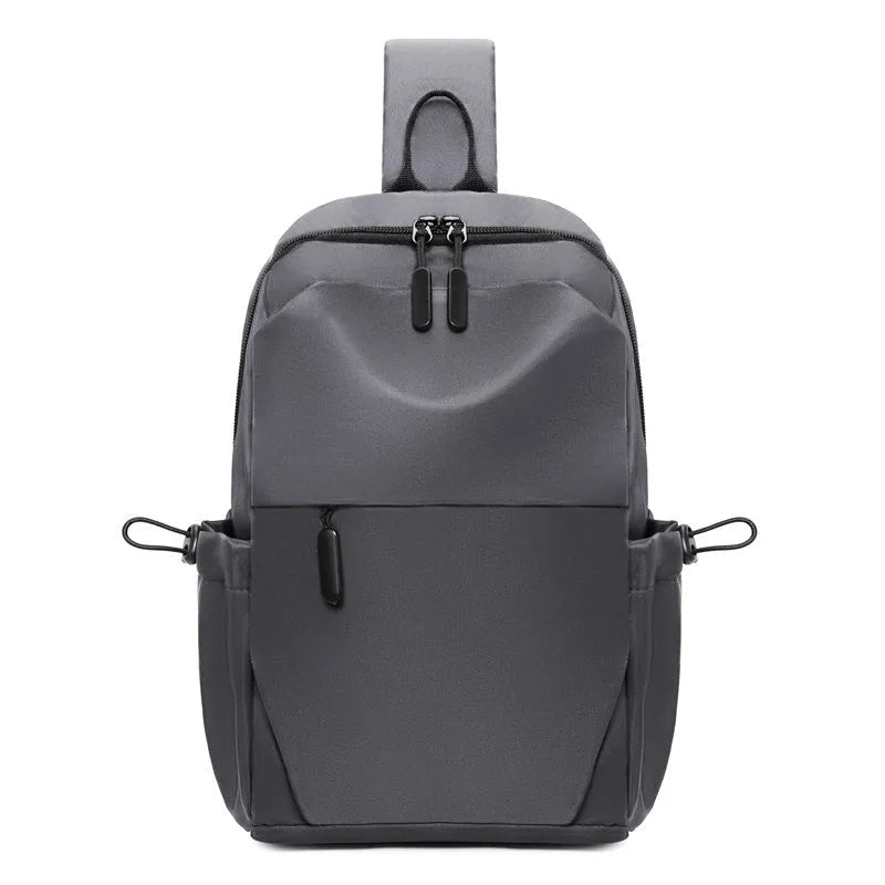 Men's waterproof messenger bag in grey showing front pocket and adjustable shoulder strap